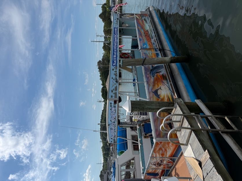 Salt Water Outlaw — side view of the boat's business graphics by Coastal Wraps
